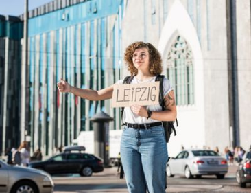 Person holding Leipzig sign